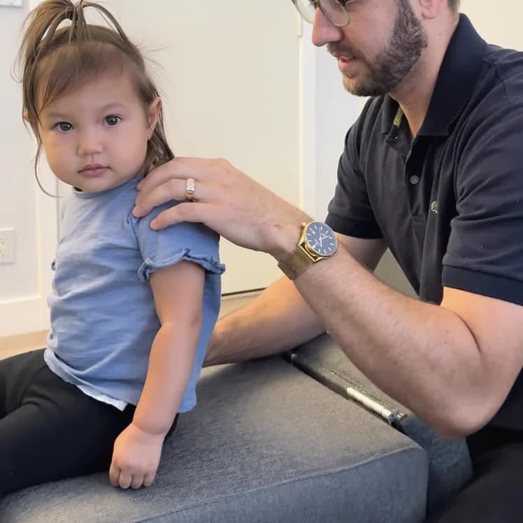 A young child being gently assessed at SeaCoast Clinic